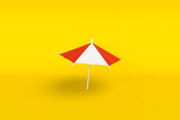 минимальный пляжный зонт на желтом фоне. символ отдыха у моря. - krung stock illustrations