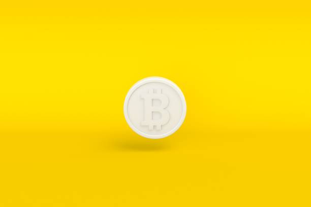 белая криптовалюта биткоин на желтом фоне. - krung stock illustrations