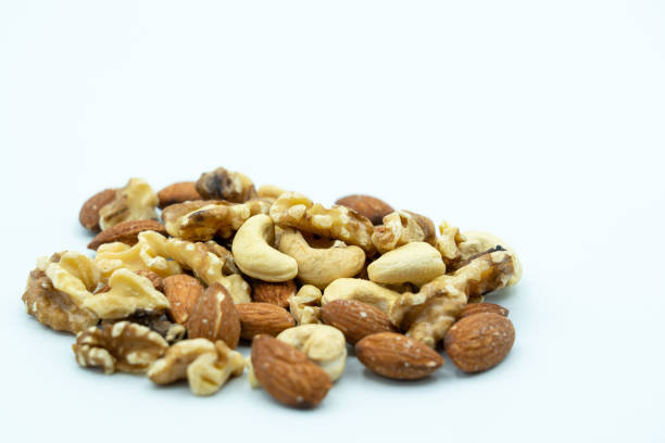 istock Photo of mixed nuts taken on a white background 1338371148