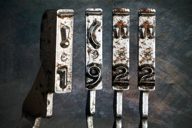 istock vintage old typewriter hammers with the date 1922 isolated 1338373071