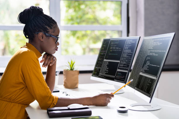 African American Woman Programmer. Girl Coding African American Woman Programmer. Girl Coding On Computer debugging stock pictures, royalty-free photos & images