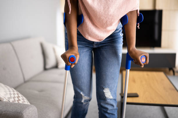 istock Walking With Crutches. Injured Broken Leg 1338373395