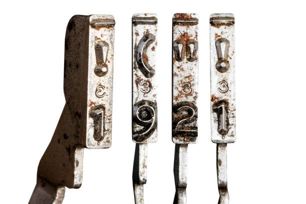 istock vintage old typewriter hammers with the date 1921 isolated 1338375151