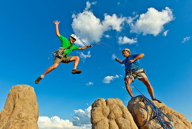 istock Rock climbing team reaching the summit. 133838134