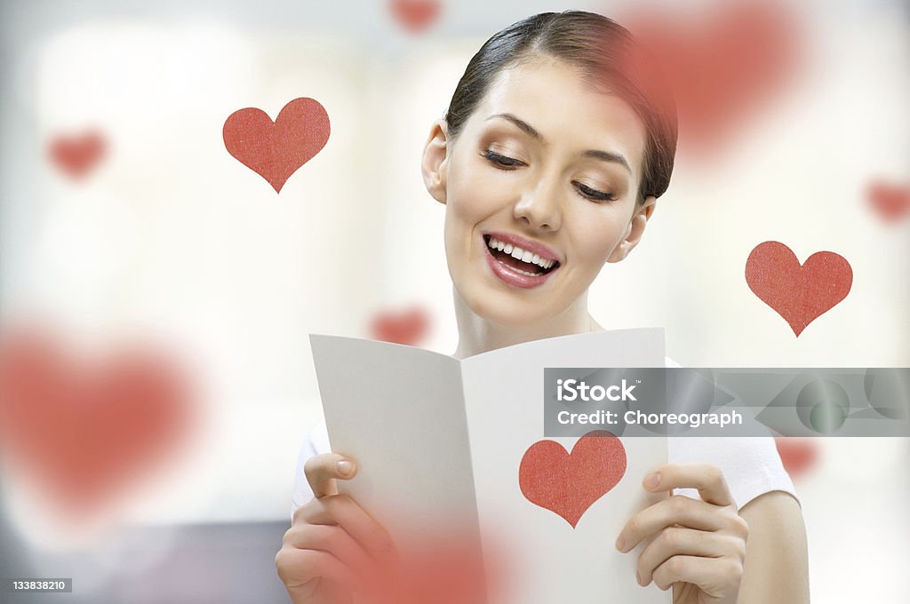 Brunette woman with love letter girl with a postcard in his hand Adult Stock Photo