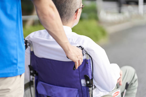 istock Caregiver supporting the elderly in wheelchairs 1338388024