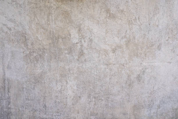 Abstract old dirty dark cement wall background on ground texture.