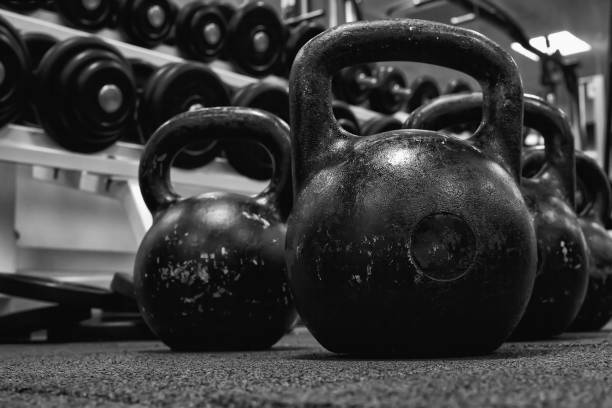 istock kettlebell weights on rubber floor ready for strength and conditioning workout, black and white image 1338389998