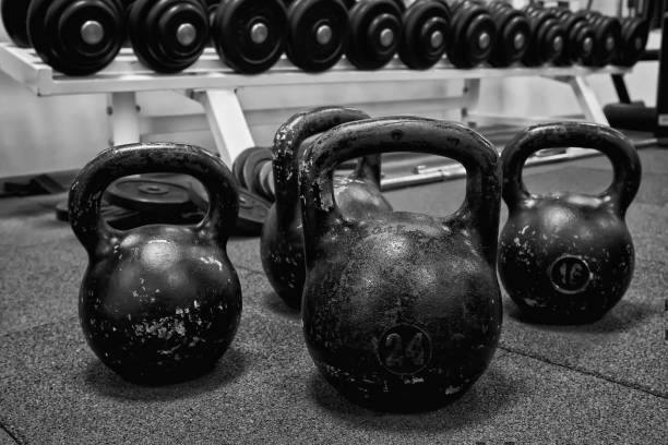 istock kettlebell weights on rubber floor ready for strength and conditioning workout, black and white image 1338390008