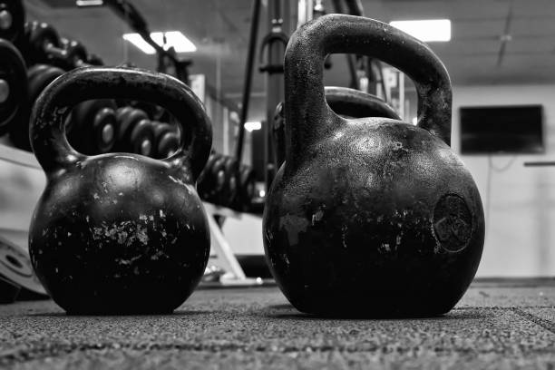 istock kettlebell weights on rubber floor ready for strength and conditioning workout, black and white image 1338390025