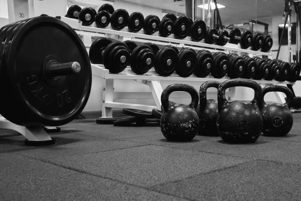 istock kettlebell weights on rubber floor ready for strength and conditioning workout, black and white image 1338390026
