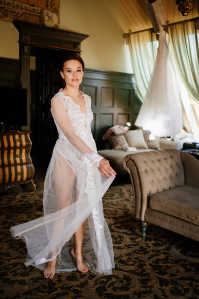 istock a beautiful bride in a lace robe in a room with a retro interior. 1338392020
