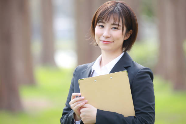 istock Female employee with binder 1338392295