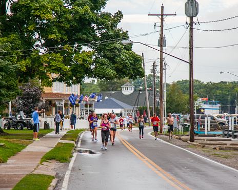 Runners, event workers and spectators gather for a 5K run in Put In Bay, Ohio