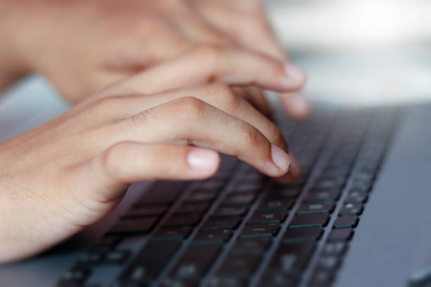 istock using computer.hand typing message on keyboard laptop chatting friend search information form internet while working on computer concept for technology device contact communication business people 1338396090