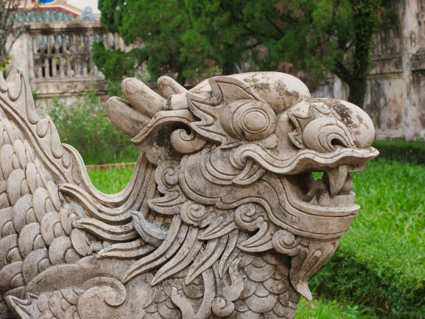 istock old stone dragon head statue in Hue, Vietnam 1338397332