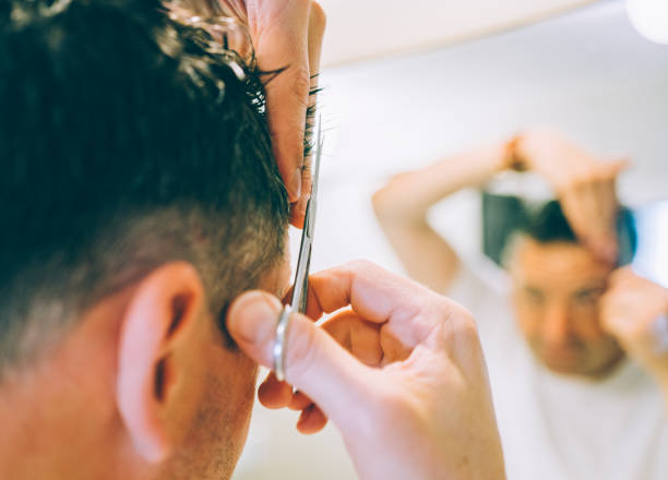 istock Man Cutting Hair at Home 1338398650