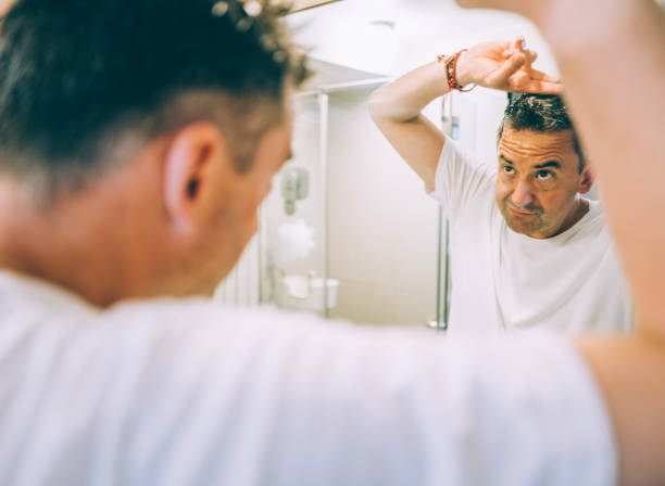 istock Man Cutting Hair at Home 1338398665
