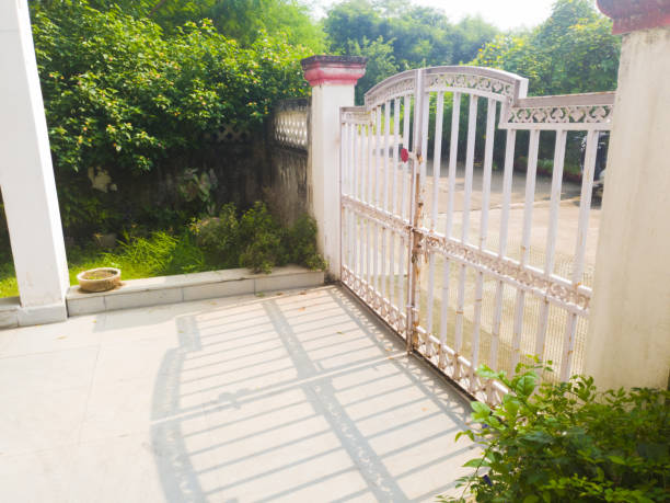 Old iron gate in the sunlight stock photo