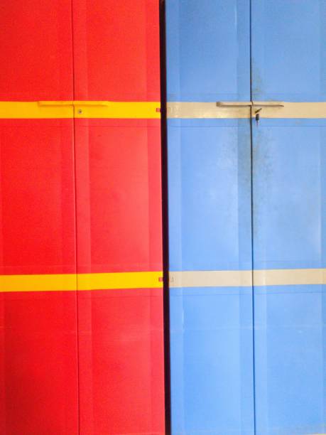 Red and Blue plastic cupboard with doors closed stock photo