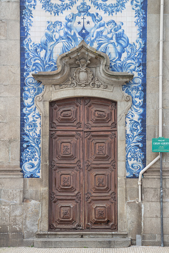 One of the walls of the chapel of Souls in Porto, Portugal. Representing a religious scene with drawn tiles.