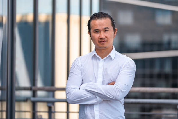 istock Asian Businessman in 30's With Hands Crossed 1338400928