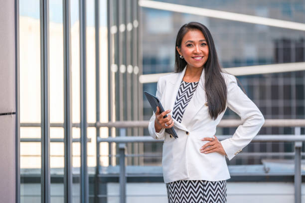 istock Asian Businesswoman in 40's Using a Tablet 1338400934