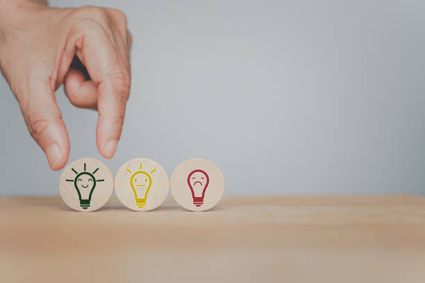 istock human's hand choose smiling bright light bulb icon on circle wood, for good idea, best selection, best solution, brain storm, leadership concept 1338401691