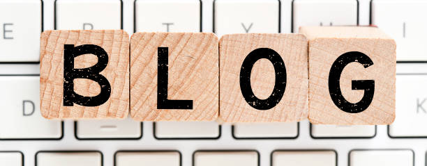 istock The word blog arranged from wooden letters arranged on a white computer keyboard. 1338405643