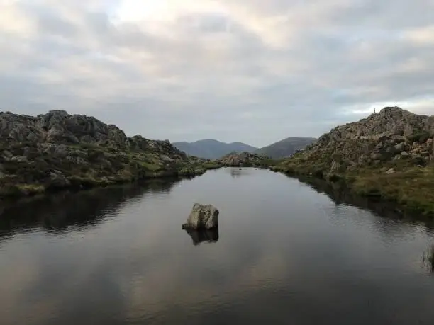 View from Haystacks at last light with sunset reflecting in pool of water