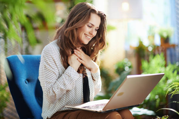 happy woman in sunny day having online meeting stock photo