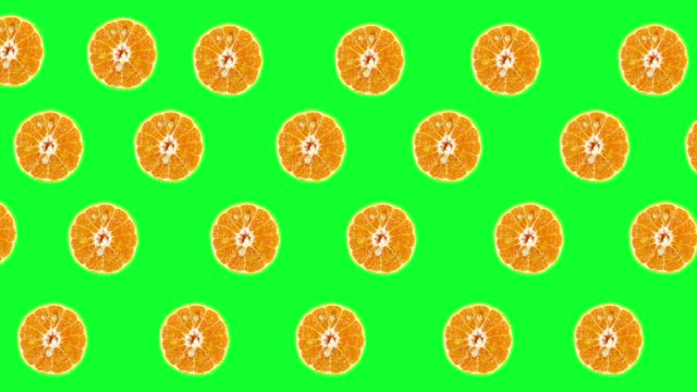 Stop motion animation, Orange turning ​with green screen on green background.
