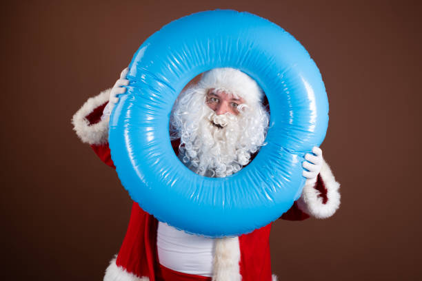 istock Funny Santa Claus drinks beer. 1338415405