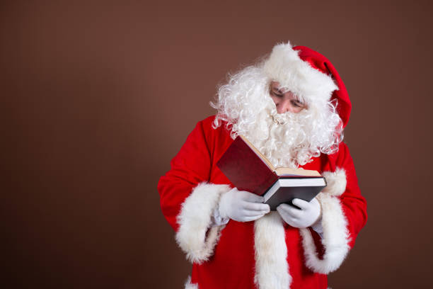 istock Funny Santa Claus reads books. 1338416063