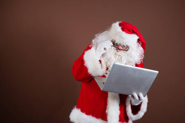 istock Funny Santa Claus reads books. 1338416306