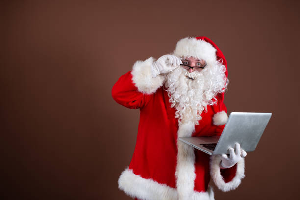 istock Funny Santa Claus reads books. 1338416444