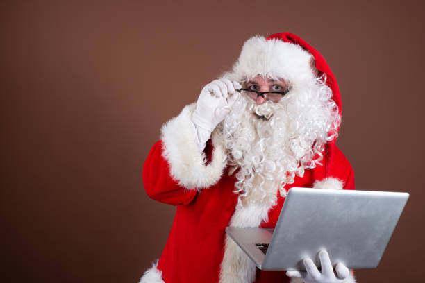 istock Funny Santa Claus reads books. 1338416468