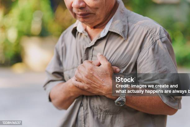 An Old Man Holds His Chest In Pain Concept Of Heart Disease Stock Photo - Download Image Now