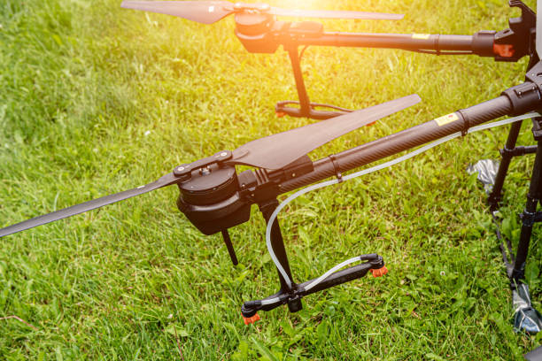 istock Professional agriculture drone on the green field 1338417724