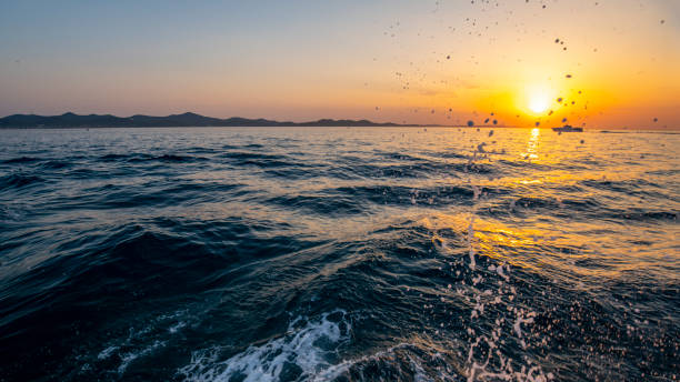 Beautiful sunset over the wavy sea.