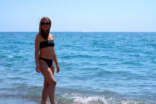 istock Girl in a black swimsuit 1338420090