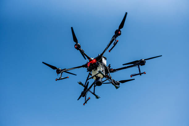 istock Professional agriculture drone flying in the blue sky 1338420230