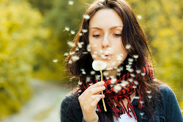 istock Girl with dandelion 133842160
