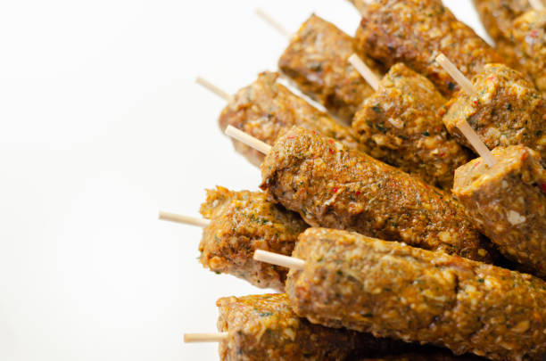 istock Minced and shaped lamb kebabs with chilli and coriander prepared for grill 1338423610