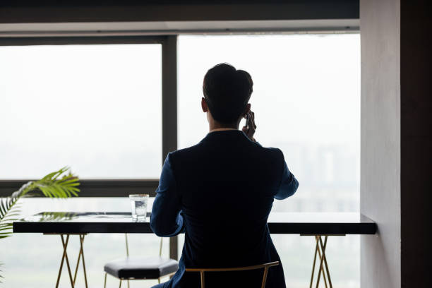 istock Young male businessmen work with laptops in the office 1338425407