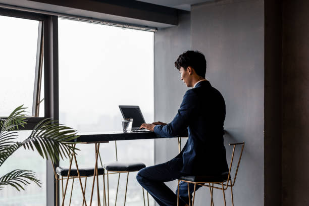 istock Young male businessmen work with laptops in the office 1338425441