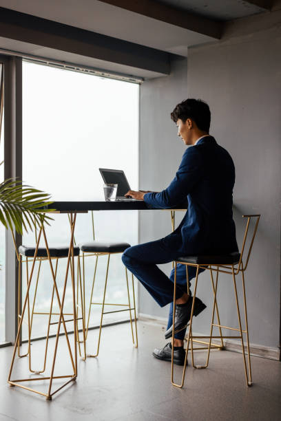 istock Young male businessmen work with laptops in the office 1338425468