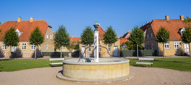 Panorama of the fountain and old houses in Christiansfeld, Denmark