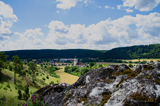 view from panoramic rock in bavaria, germany, with a church in the middle