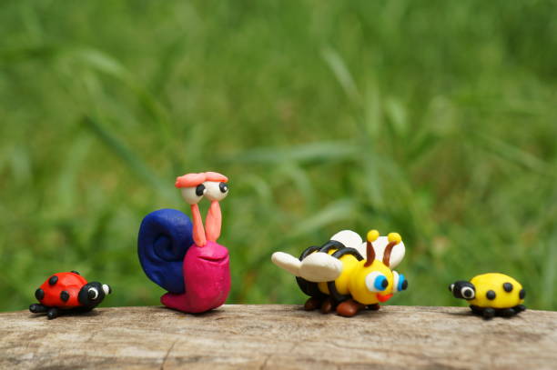 istock Figure of a snail, a ladybug and a bee close-up. 1338434584